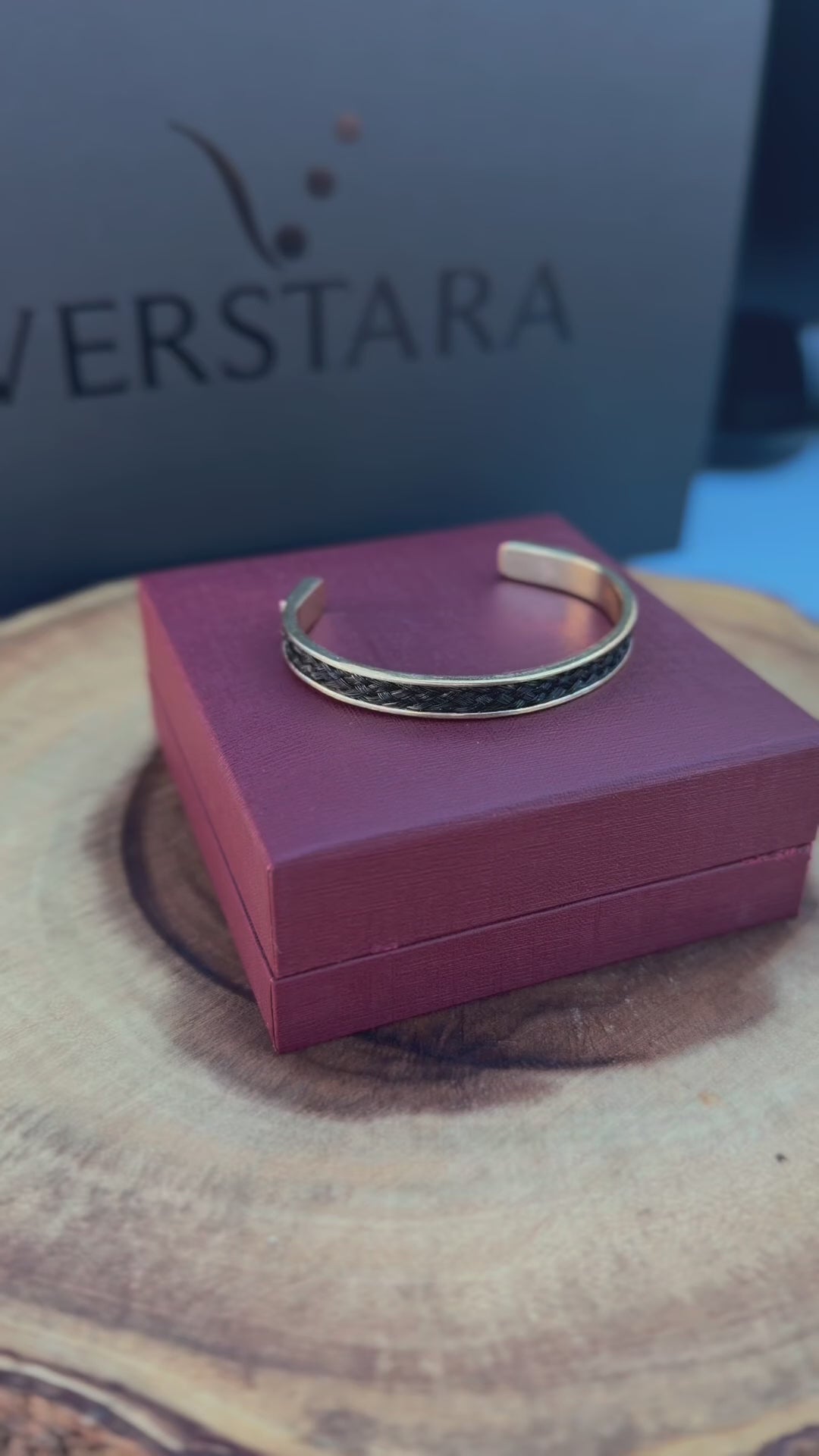 14k horsehair cuff sitting on wine red box with verstara black matte logo in background